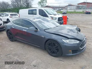 2016 Tesla Model S 90D with VIN 5YJSA1E27GF129130, listed as a IAAI auction lot 41922227 with 134,422 mi miles and . Bid and sale history available at DreamBid. Image 1.
