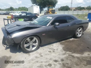 2015 Dodge Challenger R/T with VIN 2C3CDZATXFH822733, listed as a Copart auction lot 64403205 with 135,275 mi miles and Salvage title. Bid and sale history available at DreamBid. Image 1.