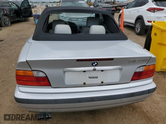1998 BMW 3 Series 323i with VIN WBABJ8332WEM22760, listed as a Copart auction lot 59631805 with 77,300 mi miles and Salvage title. Bid and sale history available at DreamBid. Image 6.