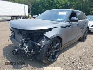 2020 Land Rover Range Rover Velar z VIN SALYM2EV8LA274870, wystawiony jako IAAI lot #42479938 z przebiegiem 43 039 mil mil oraz . Historia ofert i sprzedaży dostępna na DreamBid. Obrazek 18.