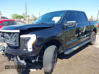2023 Ford F-150 Lightning Pro with VIN 1FTVW1EV0PWG52297, listed as a IAAI auction lot 41730201 with 11,303 mi miles. Bid and sale history available at carsss.com. Image 2.