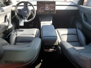 2022 Tesla Model Y Long Range with VIN 7SAYGDEE2NF402320, listed as a Copart auction lot 50396605 with 27,426 mi miles and Salvage Title. Bid and sale history available at DreamBid. Image 8.