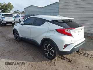 2018 Toyota C-HR XLE with VIN JTNKHMBX3J1010211, listed as a IAAI auction lot 40799443 with 104,148 mi miles. Bid and sale history available at carsss.com. Image 3.