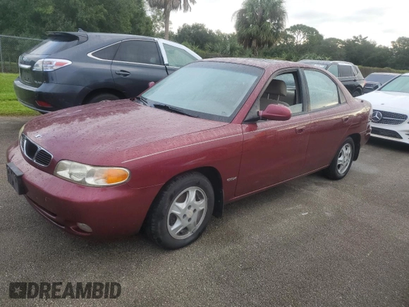 1999 Daewoo Nubira CDX z VIN KLAJB52Z5XK256700, wystawiony jako Copart lot #75085934 z przebiegiem Nie podano mil oraz Szkody całkowita. Historia ofert i sprzedaży dostępna na DreamBid. Obrazek 1.