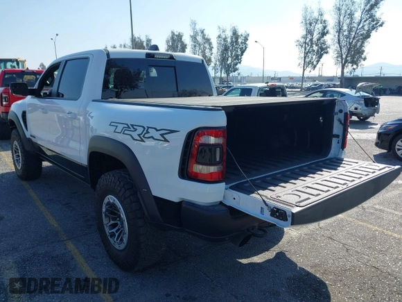 2022 Ram 1500 TRX with VIN 1C6SRFU93NN172647, listed as a IAAI auction lot 41539123 with 18,016 mi miles and . Bid and sale history available at DreamBid. Image 3.