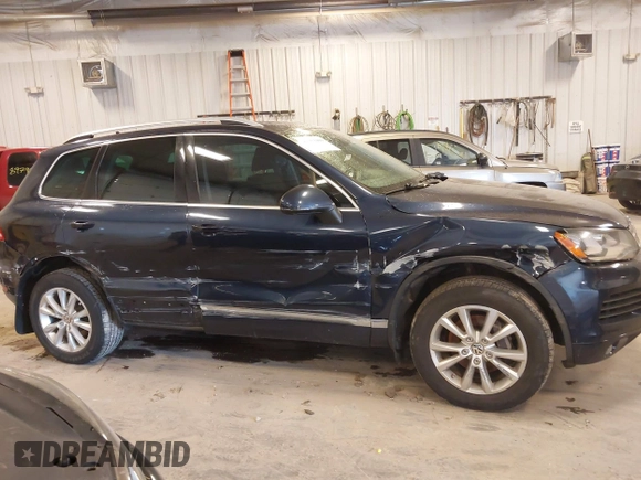 2014 Volkswagen Touareg Sport with VIN WVGEF9BP9ED008967, listed as a IAAI auction lot 41984409 with 193,859 mi miles and . Bid and sale history available at DreamBid. Image 13.