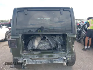 2021 Jeep Wrangler Unlimited Sport S with VIN 1C4HJXDN6MW669228, listed as a IAAI auction lot 42301326 with 64,503 mi miles and . Bid and sale history available at DreamBid. Image 16.