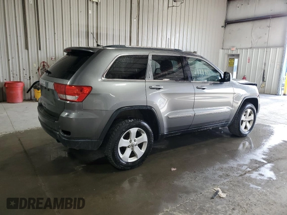 2013 Jeep Grand Cherokee Laredo with VIN 1C4RJFAG3DC612250, listed as a Copart auction lot 53155455 with 157,895 mi miles and Salvage Title. Bid and sale history available at carsss.com. Image 3.