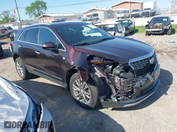 2021 Cadillac XT5 FWD Premium Luxury with VIN 1GYKNCRSXMZ118990, listed as a IAAI auction lot 41991857 with 92,085 mi miles and . Bid and sale history available at DreamBid. Image 1.