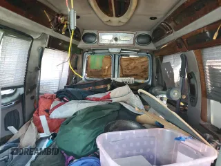 2000 Ford Econoline Cargo Recreational with VIN 1FDRE14L5YHA56690, listed as a Copart auction lot 58926155 with 162,797 mi miles and Salvage title. Bid and sale history available at DreamBid. Image 10.