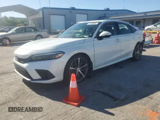 2022 Honda Civic Touring z VIN 2HGFE1F99NH301331, wystawiony jako Copart lot #57138065 z przebiegiem 77 788 mil mil oraz Szkoda całkowita • Salvage title. Historia ofert i sprzedaży dostępna na DreamBid. Obrazek 1.