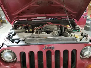 2012 Jeep Wrangler Unlimited Sport z VIN 1C4BJWDG8CL282181, wystawiony jako Copart lot #53863375 z przebiegiem 92 984 mil mil oraz Szkoda całkowita • Salvage title. Historia ofert i sprzedaży dostępna na DreamBid. Obrazek 12.