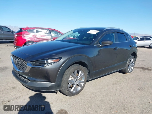 2022 Mazda CX-30 S Select z VIN 3MVDMBBL0NM415511, wystawiony jako IAAI lot #41513247 z przebiegiem Nie podano mil oraz . Historia ofert i sprzedaży dostępna na DreamBid. Obrazek 18.