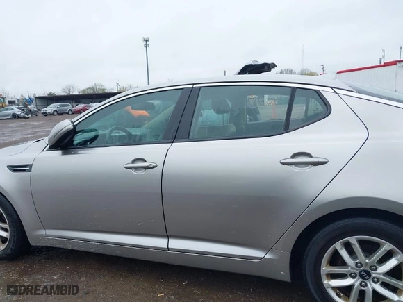2011 Kia Optima LX with VIN KNAGM4A76B5146718, listed as a IAAI auction lot 42006225 with 213,939 mi miles. Bid and sale history available at carsss.com. Image 14.