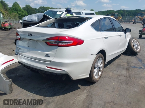 2020 Ford Fusion SE z VIN 3FA6P0LU5LR153942, wystawiony jako IAAI lot #42145638 z przebiegiem 99 961 mil mil oraz . Historia ofert i sprzedaży dostępna na DreamBid. Obrazek 4.