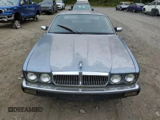 1989 Jaguar XJ with VIN SAJHY1540KC578115, listed as a Copart auction lot 69142274 with Not Provided miles and Clean Title. Bid and sale history available at DreamBid. Image 5.