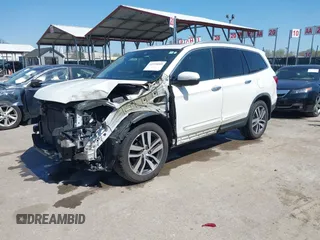 2016 Honda Pilot Touring with VIN 5FNYF6H9XGB005516, listed as a IAAI auction lot 41975049 with 85,217 mi miles. Bid and sale history available at carsss.com. Image 20.