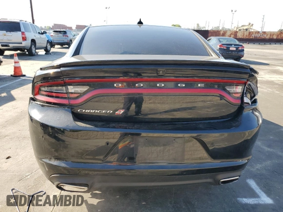 2019 Dodge Charger SXT with VIN 2C3CDXJG8KH757818, listed as a Copart auction lot 49518475 with 98,129 mi miles and Salvage Title. Bid and sale history available at DreamBid. Image 6.