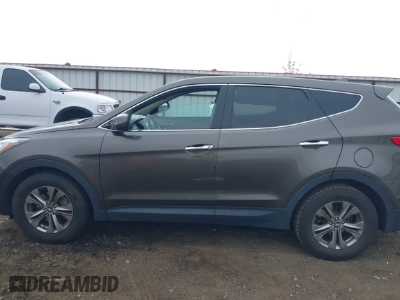 2014 Hyundai Santa Fe z VIN 5XYZTDLB1EG144290, wystawiony jako IAAI lot #42126367 z przebiegiem 138 525 mil mil oraz . Historia ofert i sprzedaży dostępna na DreamBid. Obrazek 14.