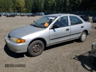 1998 Mazda Protege DX with VIN JM1BC1417W0226912, listed as a Copart auction lot 53711875 with 210,374 mi miles and Clean Title. Bid and sale history available at DreamBid. Image 1.