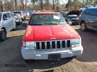 1997 Jeep Grand Cherokee Laredo with VIN 1J4GZ58S0VC550242, listed as a IAAI auction lot 41032114 with 185,307 mi miles. Bid and sale history available at carsss.com. Image 12.