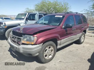 2000 Jeep Grand Cherokee Laredo with VIN 1J4G248S1YC407769, listed as a Copart auction lot 61653545 with 188,882 mi miles and Salvage title. Bid and sale history available at DreamBid. Image 1.