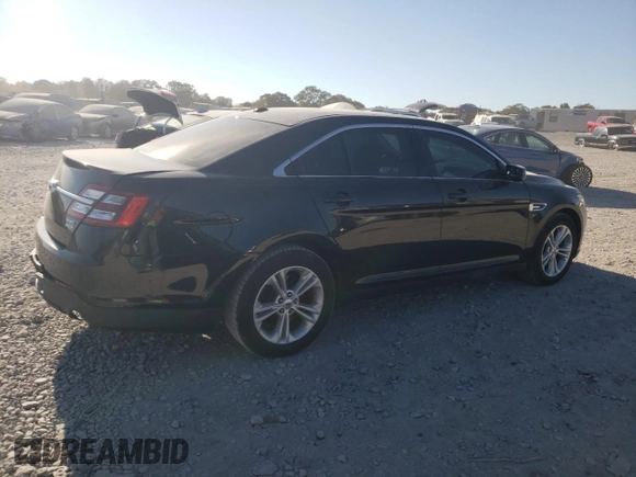 2015 Ford Taurus SEL with VIN 1FAHP2E90FG148821, listed as a Copart auction lot 77557384 with 141,514 mi miles and Salvage Title. Bid and sale history available at DreamBid. Image 3.