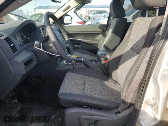 2009 Jeep Grand Cherokee Laredo with VIN 1J8HR48P89C552691, listed as a Copart auction lot 82080964 with 100,876 mi miles and Salvage Title. Bid and sale history available at carsss.com. Image 7.
