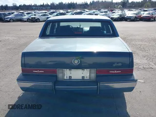 1986 Cadillac Seville z VIN 1G6KS6989GU813079, wystawiony jako IAAI lot #41732353 z przebiegiem Nie podano mil oraz . Historia ofert i sprzedaży dostępna na DreamBid. Obrazek 16.
