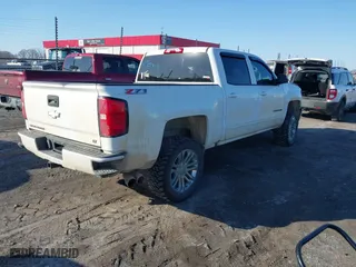 2016 Chevrolet Silverado 1500 LT with VIN 3GCUKREC6GG306239, listed as a IAAI auction lot 41380251 with 128,042 mi miles. Bid and sale history available at carsss.com. Image 4.