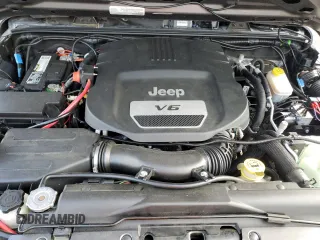 2017 Jeep Wrangler Unlimited Sport with VIN 1C4BJWDG8HL680627, listed as a Copart auction lot 61241735 with 100,890 mi miles and Salvage title. Bid and sale history available at DreamBid. Image 11.