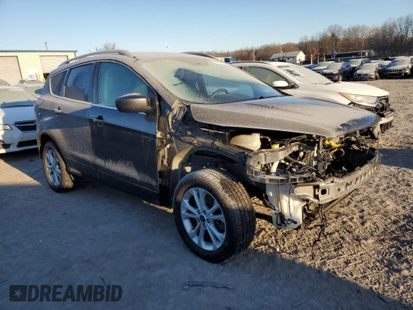 2018 Ford Escape SE z VIN 1FMCU9GD7JUA19262, wystawiony jako Copart lot #84627944 z przebiegiem 89 993 mil mil oraz Szkoda całkowita • Salvage title. Historia ofert i sprzedaży dostępna na DreamBid. Obrazek 4.