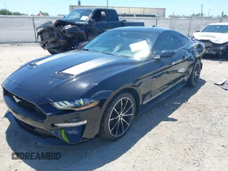 2021 Ford Mustang EcoBoost with VIN 1FA6P8TH1M5137372, listed as a IAAI auction lot 42031716 with 58,475 mi miles and . Bid and sale history available at DreamBid. Image 2.
