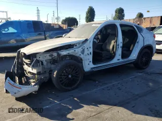 2016 BMW X6 sDrive35i with VIN 5UXKU0C56G0F92990, listed as a Copart auction lot 77191074 with 194,077 mi miles and Salvage Title. Bid and sale history available at carsss.com. Image 1.