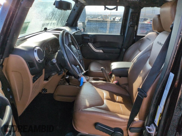 2013 Jeep Wrangler Unlimited Rubicon 10th Anniversary z VIN 1C4HJWFG6DL557085, wystawiony jako Copart lot #41693075 z przebiegiem 139 240 mil mil oraz Szkoda całkowita • Salvage title. Historia ofert i sprzedaży dostępna na DreamBid. Obrazek 7.