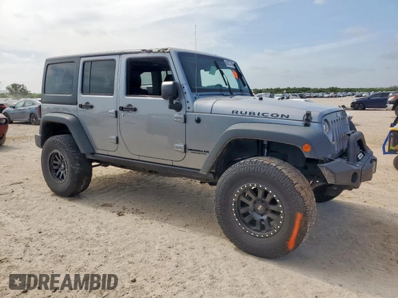 2015 Jeep Wrangler Unlimited Rubicon z VIN 1C4BJWFG0FL529310, wystawiony jako Copart lot #64337405 z przebiegiem Nie podano mil oraz Szkoda całkowita • Salvage title. Historia ofert i sprzedaży dostępna na DreamBid. Obrazek 4.