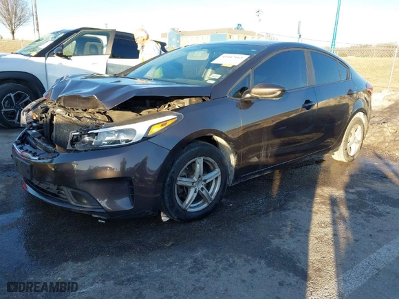 2017 Kia Forte LX with VIN 3KPFL4A77HE133233, listed as a IAAI auction lot 41447165 with 122,328 mi miles. Bid and sale history available at carsss.com. Image 2.