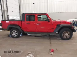 2020 Jeep Gladiator Sport S z VIN 1C6HJTAGXLL125496, wystawiony jako IAAI lot #41749633 z przebiegiem 56 203 mil mil oraz . Historia ofert i sprzedaży dostępna na DreamBid. Obrazek 13.