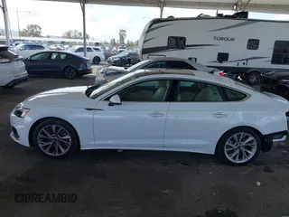 2023 Audi A5 Sportback Premium z VIN WAUABCF54PA052249, wystawiony jako IAAI lot #41916508 z przebiegiem 19 062 mil mil oraz . Historia ofert i sprzedaży dostępna na DreamBid. Obrazek 14.