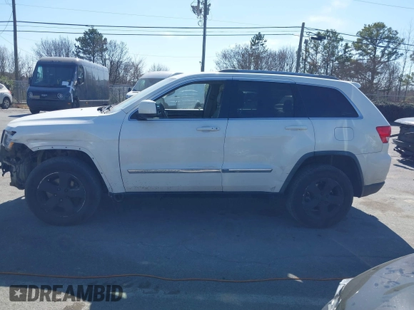 2012 Jeep Grand Cherokee Laredo with VIN 1C4RJFAT4CC229204, listed as a IAAI auction lot 41659491 with 141,143 mi miles. Bid and sale history available at carsss.com. Image 14.