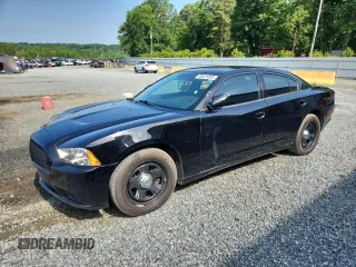 2013 Dodge Charger Police with VIN 2C3CDXAT2DH694702, listed as a Copart auction lot 59621085 with 194,518 mi miles and Salvage title. Bid and sale history available at DreamBid. Image 1.