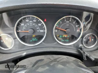 2013 Jeep Wrangler Unlimited Sport with VIN 1C4BJWDG8DL639781, listed as a Copart auction lot 63620025 with 84,720 mi miles and Salvage title. Bid and sale history available at DreamBid. Image 9.