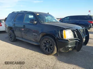 2014 GMC Yukon SLT with VIN 1GKS1CE00ER247249, listed as a IAAI auction lot 41271351 with 215,044 mi miles. Bid and sale history available at carsss.com. Image 1.