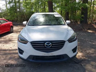 2016 Mazda CX-5 Grand Touring with VIN JM3KE2DY0G0870077, listed as a IAAI auction lot 42158225 with 93,816 mi miles. Bid and sale history available at carsss.com. Image 12.