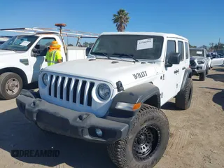 2023 Jeep Wrangler Willys with VIN 1C4HJXDG0PW638871, listed as a IAAI auction lot 42700599 with 16,171 mi miles and . Bid and sale history available at DreamBid. Image 17.