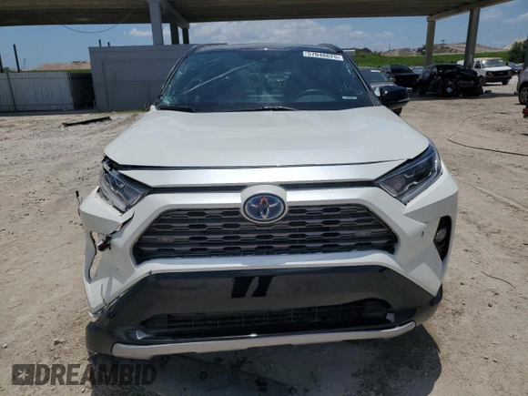 2021 Toyota RAV4 Hybrid XSE with VIN 4T3E6RFV3MU061808, listed as a Copart auction lot 57048025 with 20,614 mi miles and Salvage title. Bid and sale history available at DreamBid. Image 5.