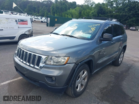2011 Jeep Grand Cherokee Laredo with VIN 1J4RR4GG7BC736694, listed as a IAAI auction lot 42758461 with 159,875 mi miles and . Bid and sale history available at DreamBid. Image 2.