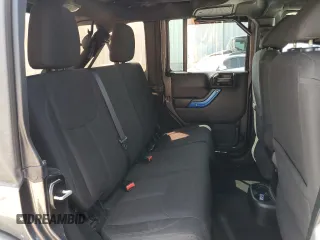 2018 Jeep Wrangler JK Unlimited Sport S with VIN 1C4BJWDG3JL899209, listed as a Copart auction lot 67705634 with 100,679 mi miles and Salvage Title. Bid and sale history available at carsss.com. Image 11.