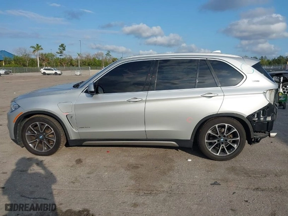 2018 BMW X5 xDrive40e iPerformance with VIN 5UXKT0C53J0V98060, listed as a IAAI auction lot 41456809 with 75,407 mi miles. Bid and sale history available at carsss.com. Image 15.