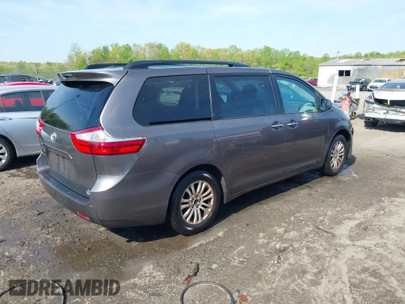 2015 Toyota Sienna XLE with VIN 5TDYK3DC9FS685768, listed as a IAAI auction lot 42062942 with 132,242 mi miles. Bid and sale history available at carsss.com. Image 4.